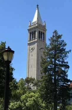 A clock tower with trees in the background